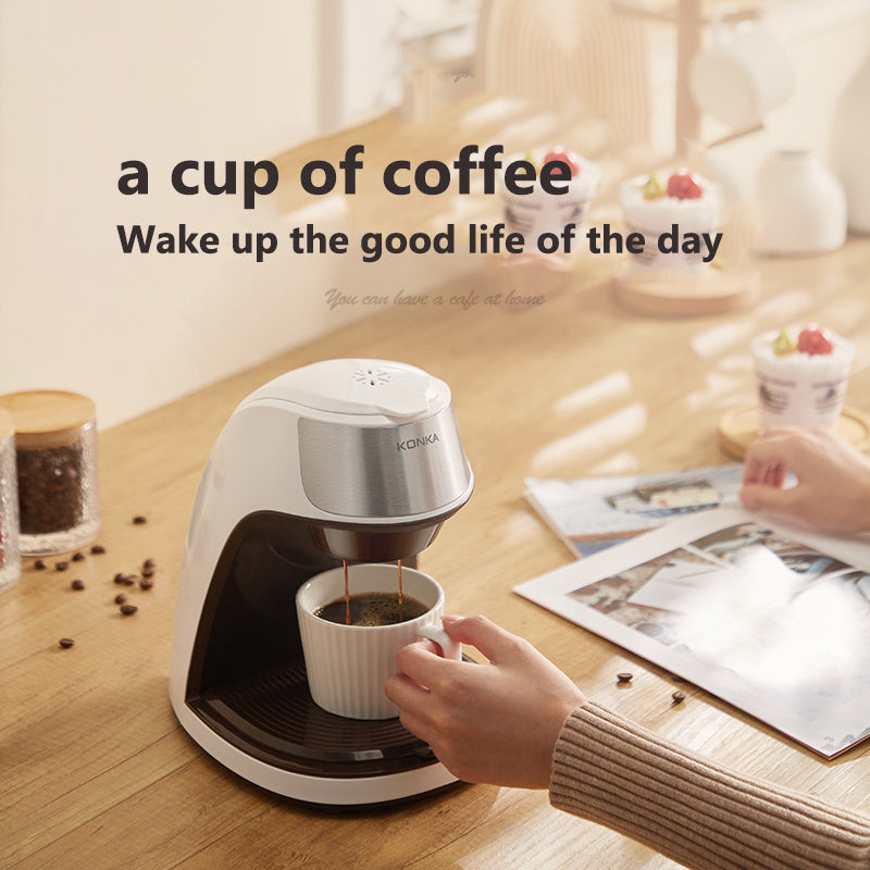 Compact Fully Automatic Home Coffee Maker brewing coffee at home with a cup on the table.