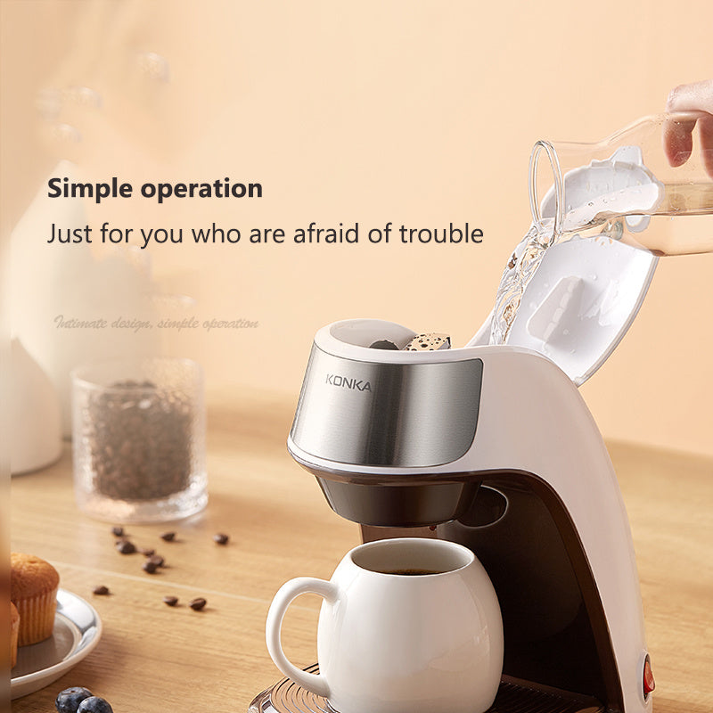 Compact Fully Automatic Home Coffee Maker brewing coffee at home with a cup on the table.