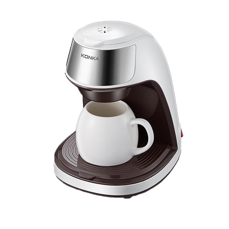 Compact Fully Automatic Home Coffee Maker brewing coffee at home with a cup on the table.