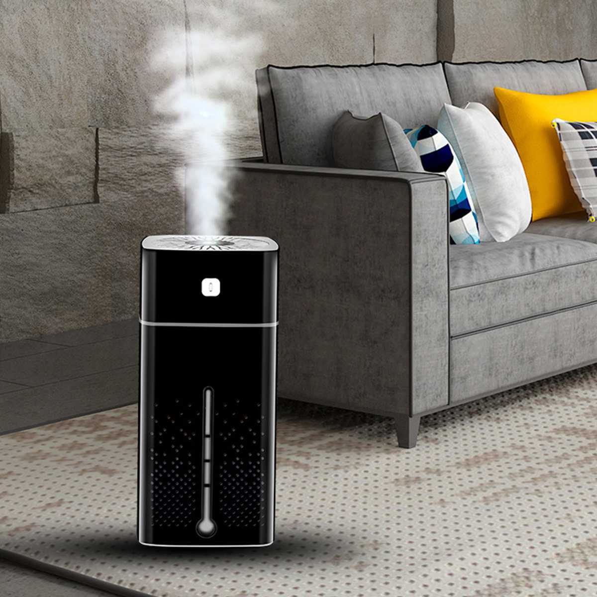 Air Purifier Humidifier in black and white, emitting mist, ideal for improving indoor air quality.