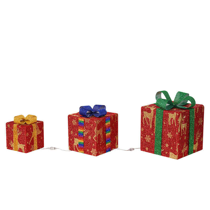 Outdoor Christmas Tree Luminous Gift Boxes decorated with colorful ribbons and stars, glowing warmly in a festive setting.